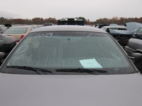 2001 Ford Crown Victoria - Chalk markings on the windshield indicate '2006' and '2029', with a paper slip on the dashboard.