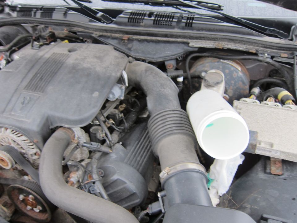 Engine bay of a 2001 Ford Crown Victoria, showing the air intake system and engine components