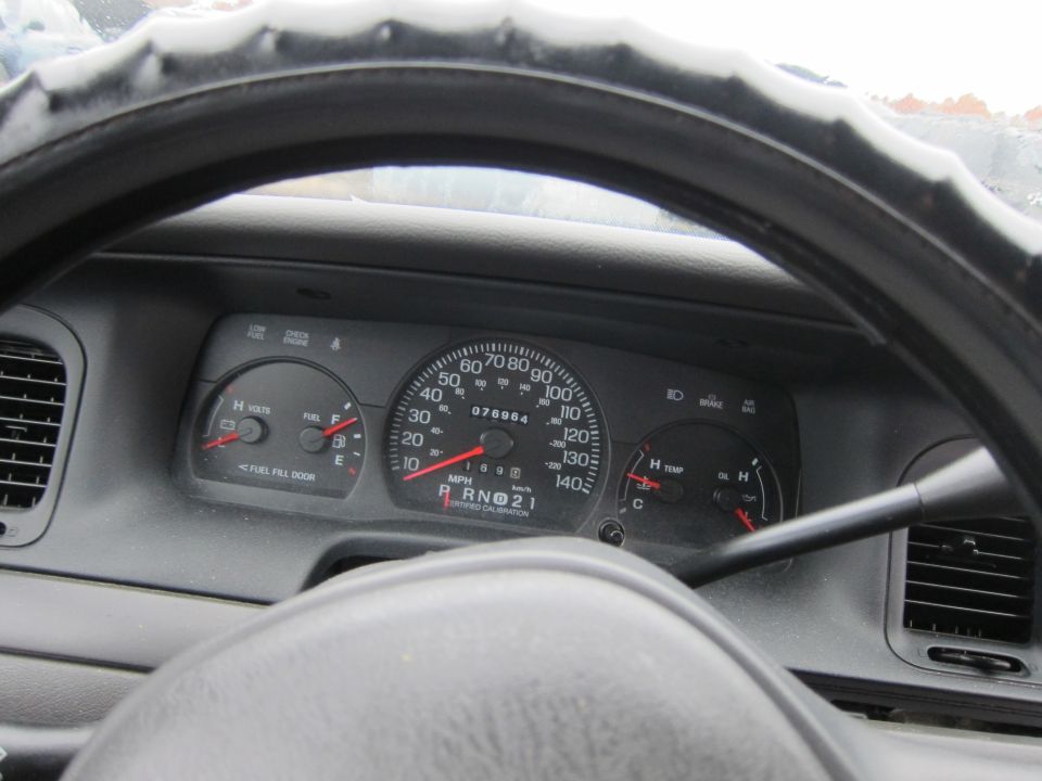 2001 Ford Crown Victoria interior dashboard with odometer showing 076964 miles