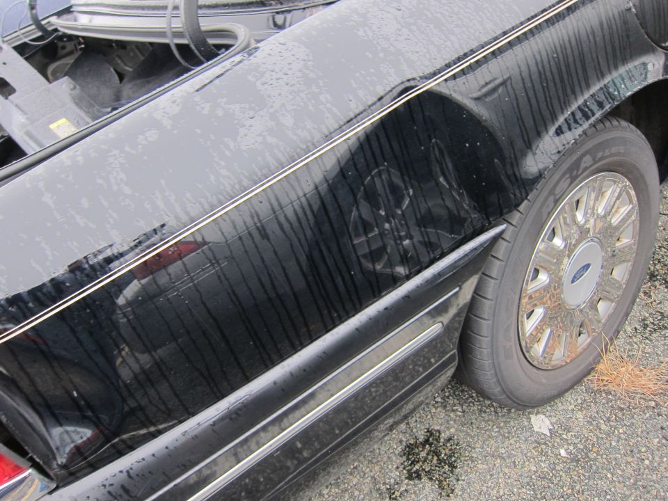 2001 Ford Crown Victoria side view showing fender and wheel