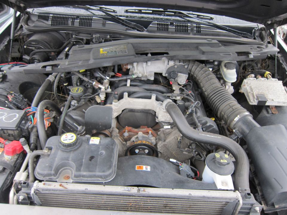 Engine bay of a 2001 Ford Crown Victoria, showing the V8 engine, radiator, and air intake system