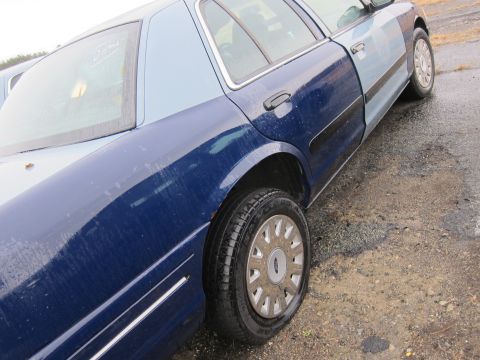 2001 Ford Crown Victoria - This 2001 Ford Crown Victoria is seen from the side, a two-tone blue paint scheme.