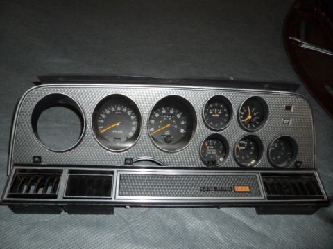 1994 Jeep Cherokee - Instrument cluster from a vehicle, multiple gauges and air vents.