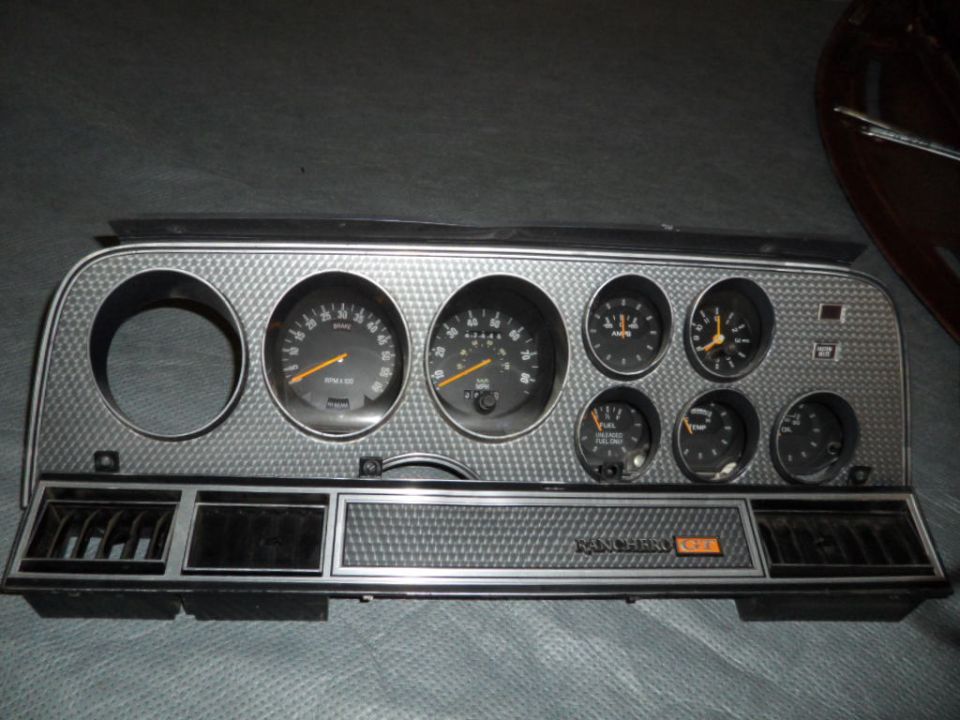 Dashboard instrument cluster with gauges and vents, reads 'RANCHERO GT'