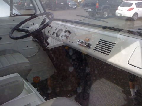 1968 Ford Mustang - Interior view of a van, showing the dashboard, steering wheel, and seats.