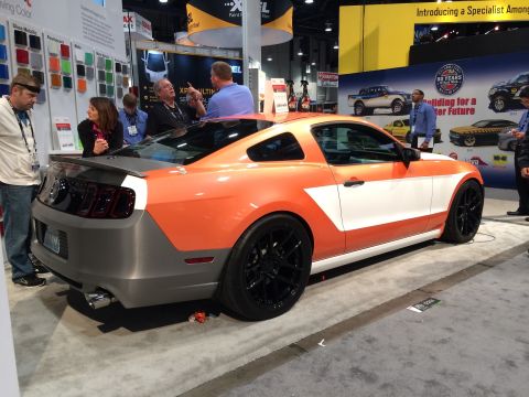 2013 Ford Mustang - A customized Ford Mustang with a unique paint scheme is shown at an automotive event.