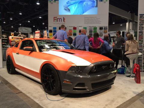 2013 Ford Mustang - A custom-wrapped 2013 Ford Mustang is displayed at an automotive event.