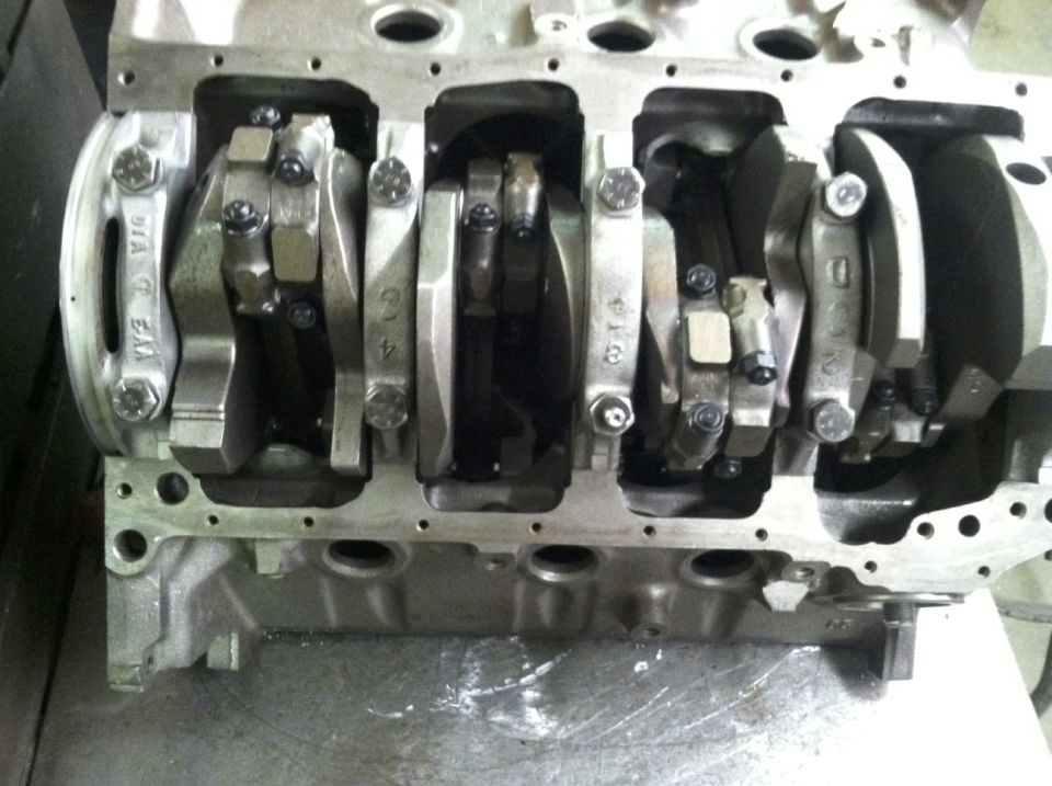 Close-up of engine block showing crankshaft and connecting rods.