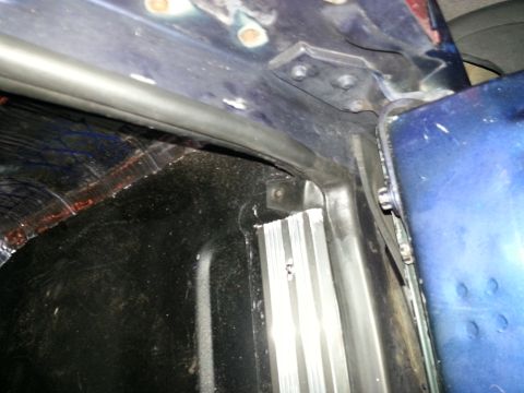 1994 Ford Bronco - Photograph of a vehicle body corner and panel seam, not a technical document.