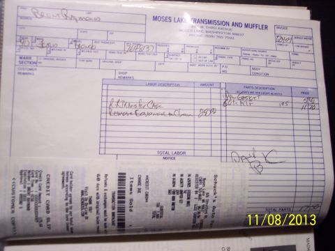 1990 Ford Bronco - A document with handwritten notes and printed text is shown, likely a service record or parts list.