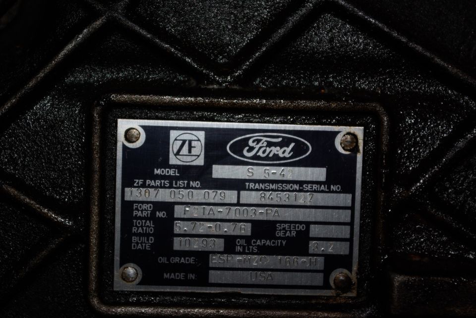 Close-up of a Ford ZF transmission data plate with part numbers and specifications.