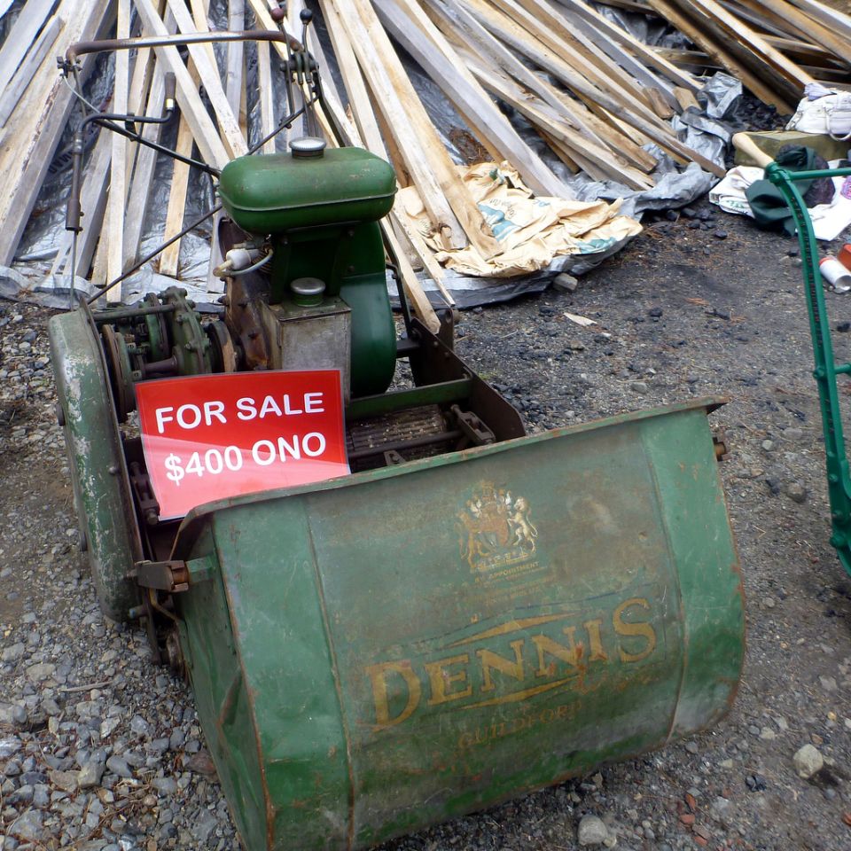 Vintage green Dennis reel mower with a "FOR SALE $400 ONO" sign.