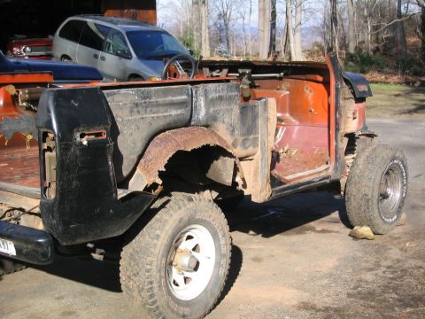 1978 Ford Bronco - This vehicle is missing many body panels and appears to be undergoing restoration or is in a state of disrepair.