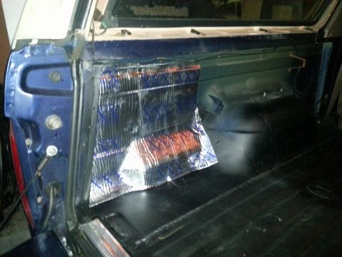 1994 Ford Bronco - Sound deadening material is visible in the cargo area of a vehicle.