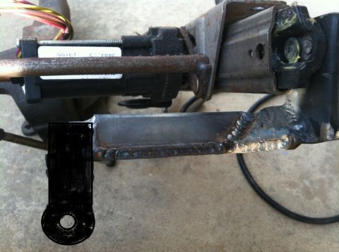 1994 Ford Bronco - Photograph of a welded steel bracket on a frame member, not a technical document.