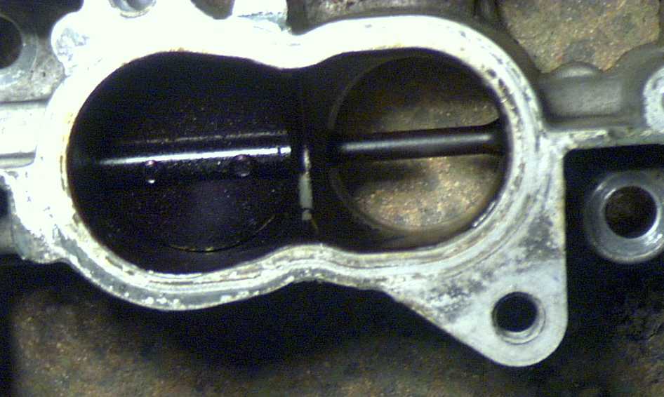 Throttle body with dual openings, likely for an engine intake
