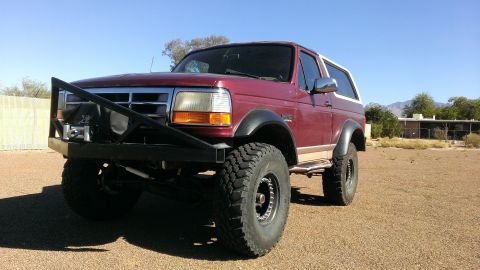 1996 Ford Bronco - This lifted Ford Bronco is equipped with a heavy-duty front bumper and winch, ready for off-road adventures.