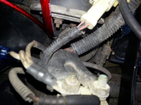 1994 Ford Bronco - Engine wiring harness detail, a red cable and the SuperMotors logo visible at the bottom.