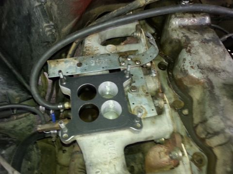1981 Ford Bronco - Carburetor base plate and intake manifold assembly, likely for an older vehicle.