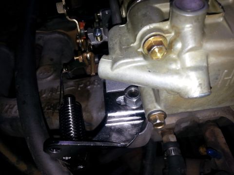 1981 Ford Bronco - Close-up view of engine components, including a carburetor and associated hardware.