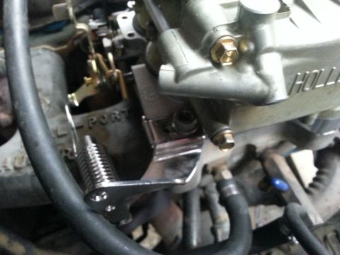1981 Ford Bronco - Close-up view of a Holley carburetor, showing intricate linkage and fuel lines.
