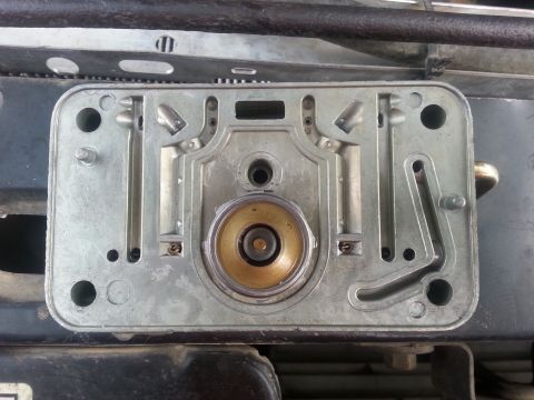 1981 Ford Bronco - Carburetor base plate detail, showing internal fuel delivery components.