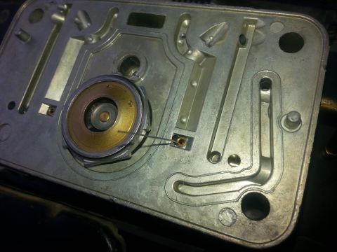 1981 Ford Bronco - Close-up view of a carburetor part, likely from a vehicle's engine.