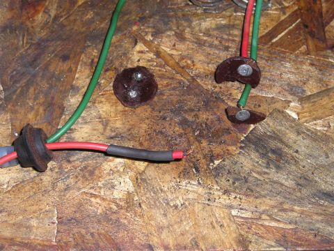 1975 Ford Courier - Close-up of automotive electrical wiring, showing connections and insulation on a wooden background.