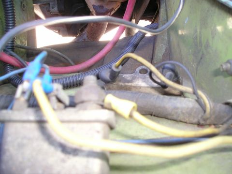 1975 Ford Courier - Close-up of vehicle electrical wiring and components in the engine bay.