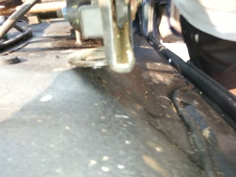 1994 Ford Bronco - Detail of vehicle frame and seat mounting hardware, with a watermark at the bottom right.