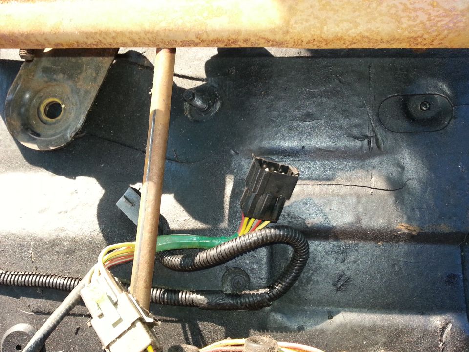 Close-up of a vehicle seat's wiring harness and connector