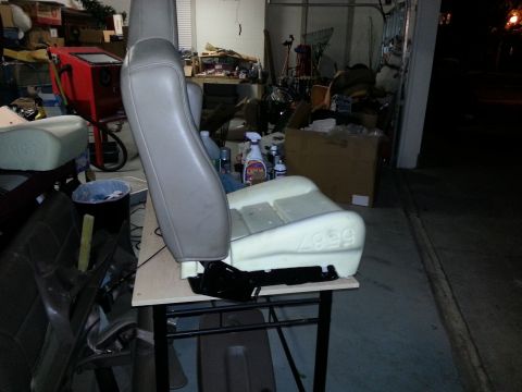 1994 Ford Bronco - A car seat is shown on a table, with the foam base revealing the molded numbers '4899'.