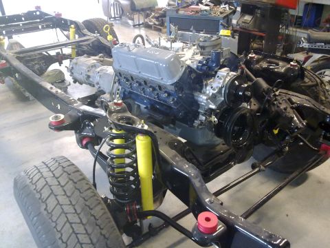 1984 Ford Bronco - The chassis of a 1984 Ford Bronco is shown with its engine and transmission during a rebuild.