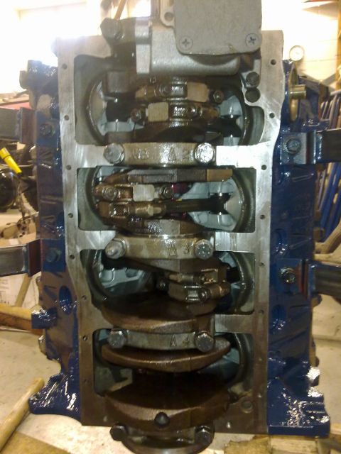 1984 Ford Bronco - Close-up view of an engine block's internal components, showing the crankshaft and connecting rods.