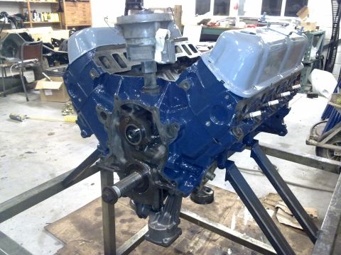 1984 Ford Bronco - Engine on a stand, partially disassembled and painted blue. The registry claims it is a 1984 Ford Bronco engine.