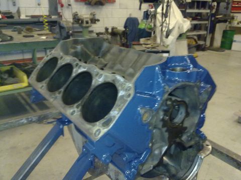 1984 Ford Bronco - Engine block on a stand, likely undergoing rebuild or restoration.