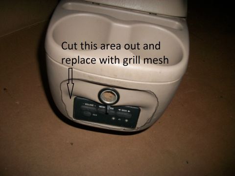 1994 Ford Bronco - Interior center console part with cupholders and stereo controls, marked with an arrow indicating an area to be cut out and replaced with g…