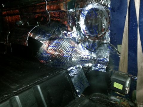 1994 Ford Bronco - Sound deadening material is being installed on the interior panels of a vehicle.
