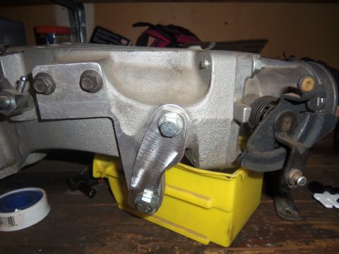 1968 Ford Bronco - Close-up of an engine intake manifold and throttle body assembly, likely for a V8 engine.