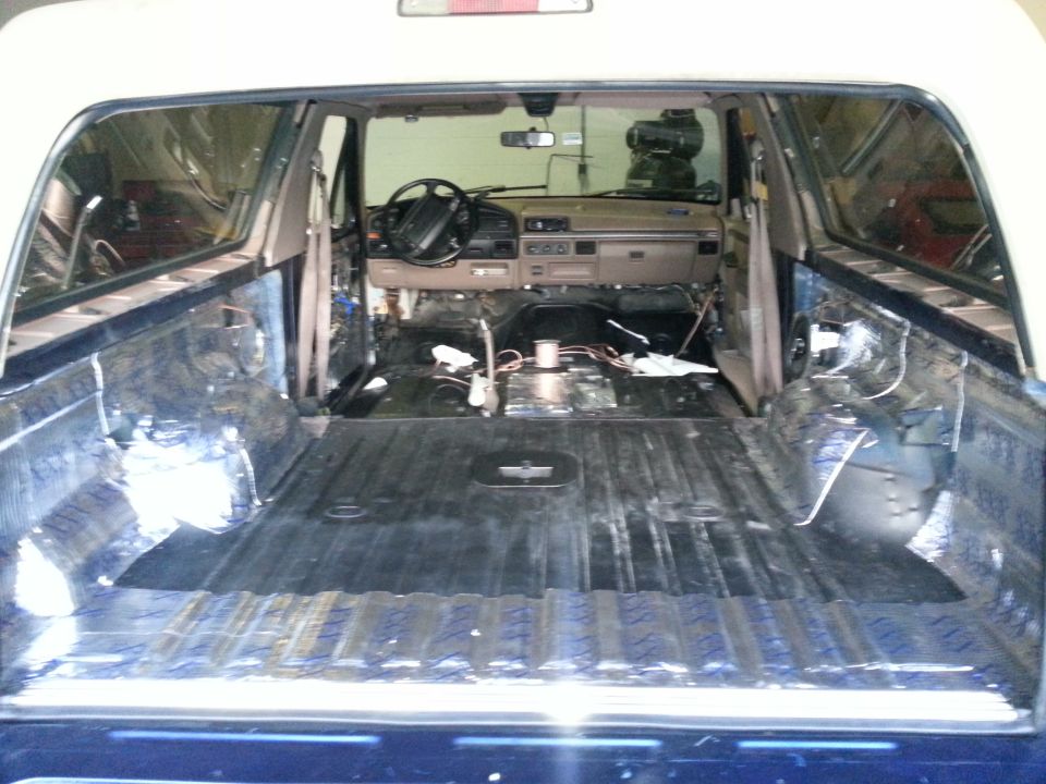 1994 Ford Bronco interior, stripped down with exposed wiring and insulation