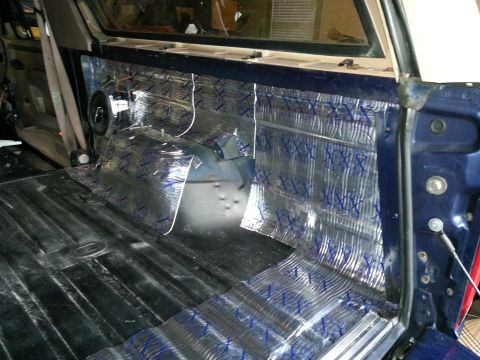 1994 Ford Bronco - Sound deadening material being installed on the interior panels and floor of a vehicle.