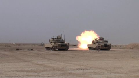 1982 Ford Bronco - Two tanks are engaged in live fire exercises in a desert environment, creating a large explosion.