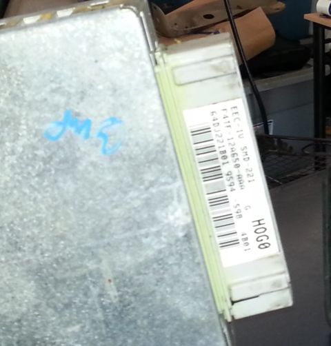 1994 Ford Bronco - Close-up of an engine control module, identified by the label F4TF-12A650-RAA.