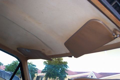1986 Ford Bronco - Interior view of a 1986 Ford Bronco, focusing on the headliner and sun visors.
