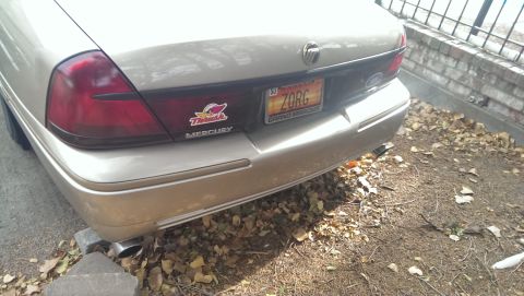 2000 Mercury Grand Marquis - Rear view of a gold 2000 Mercury Grand Marquis with a ZORG license plate.