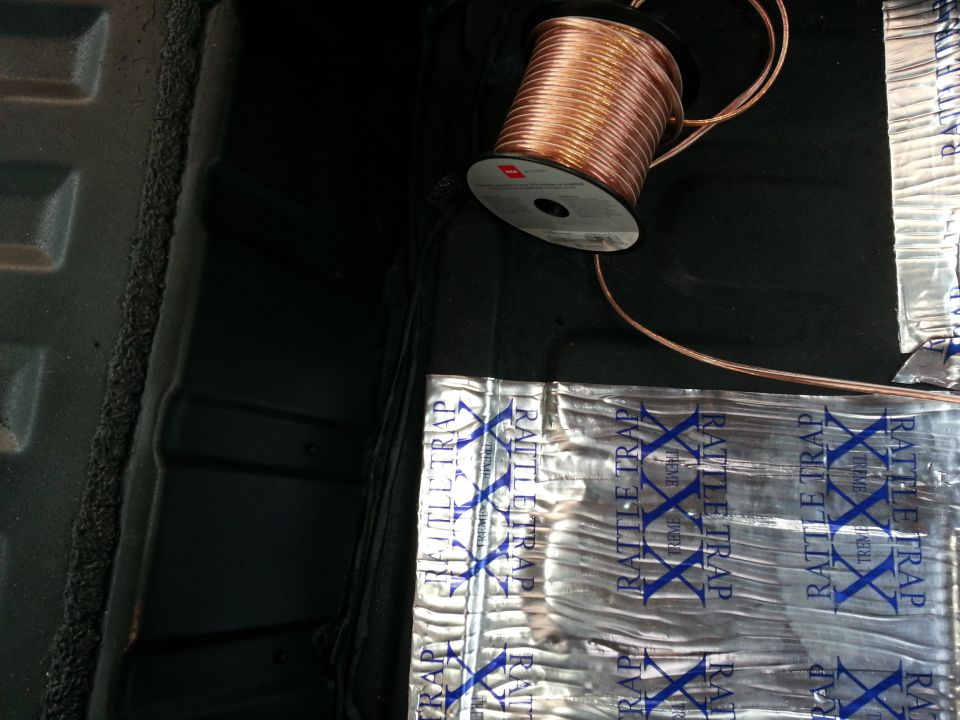 Interior cargo area with sound deadening material and copper wire spool