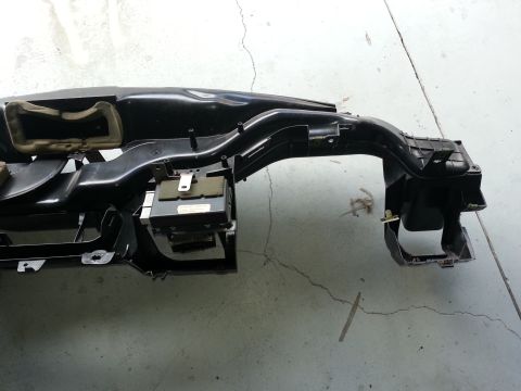 1994 Ford Bronco - A detached vehicle dashboard section is shown, revealing internal components and air ducting.