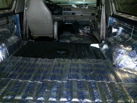 1994 Ford Bronco - Interior of a 1994 Ford Bronco undergoing sound deadening installation.