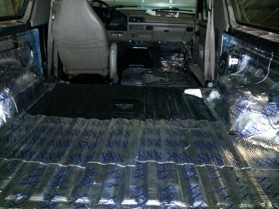 1994 Ford Bronco interior with sound deadening material on floor and rear cargo area