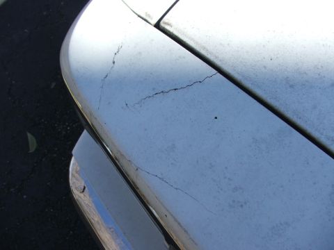 1988 Ford Crown Victoria LTD - The paint on this car's hood is cracked, showing wear and tear. A Supermotors watermark is present.